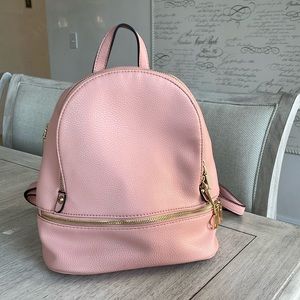 Pink mini backpack with gold zipper